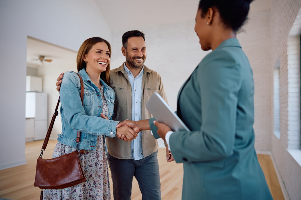 Real estate agents discussing client solutions